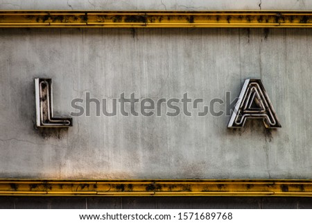 detail of old neon inscription with the letters LA in Los Angeles California Royalty-Free Stock Photo #1571689768