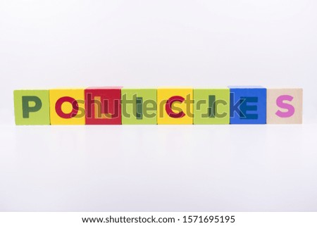 POLICIES word made with building colored blocks