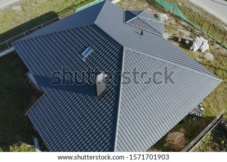 Modern roof made of metal. Corrugated metal roof and metal roofing.