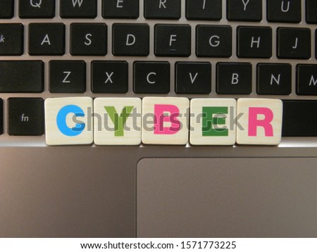 Word Cyber on keyboard background