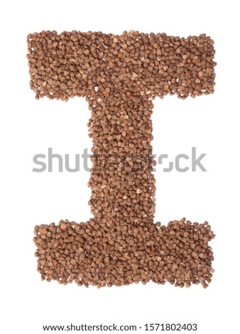 Letter I of the English alphabet from  brown dry buckwheat  on a white isolated background. Food pattern made from groats. Bright alphabet for shops.  Buckwheat for porridge