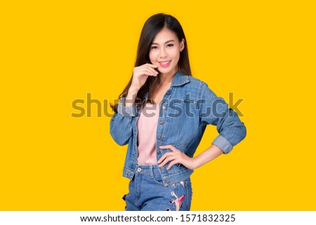 Portrait of a beautiful asian young woman on pink background. Body language, symbol, gestures, beauty and fashion concept.