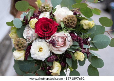 Close up picture of beautiful engagement bouquet, fall colors, eucalyptus leaf