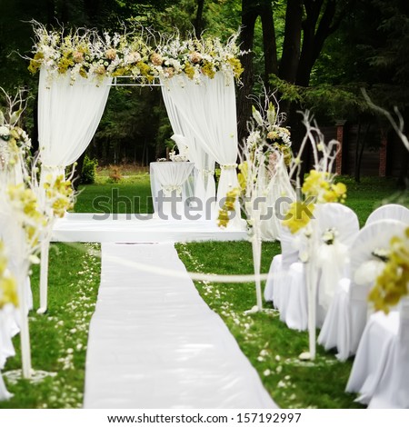 Beautiful wedding ceremony in sunny garden. Royalty-Free Stock Photo #157192997