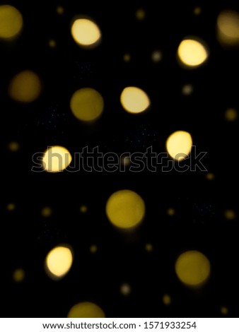 Bright background with gold bokeh for Christmas cards on black background