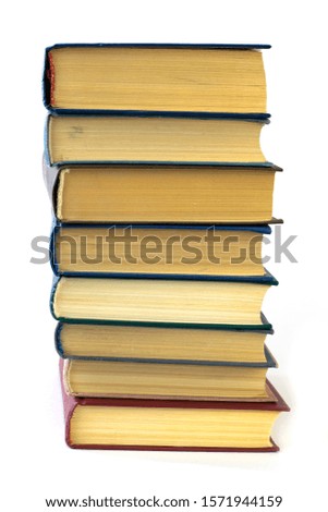 stack of eight books isolated on white background