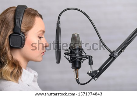 Speech recording on radio stations, the announcer works in the studio with a studio microphone