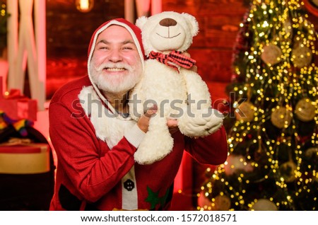 Kind grandpa with teddy bear. Christmas decoration. Charity and kindness. Lovely hug. Santa Claus. Mature man with white beard. Christmas spirit. Bearded grandfather senior man celebrate christmas.