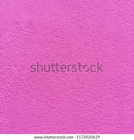 background wall with putty painted pink texture surface.
