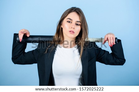 Life game. Pretty and dangerous. Business strategy. Aggressive business. Business lady boss. Decisive actions. Confidence and strength. Woman pretty girl bear formal jacket and hold baseball bat.