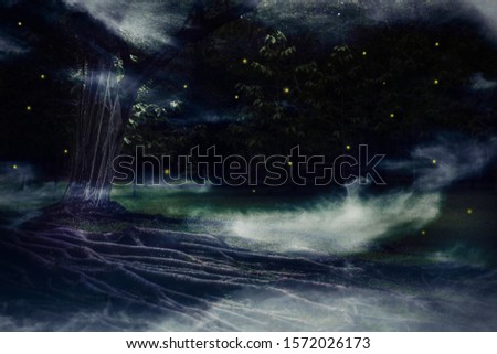 closeup tree trunk with big roots and fireflies among mist in dark night green forest