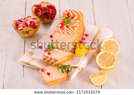 Lemon sponge cake with pomegranate.