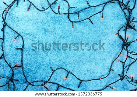 Blue christmas background. Christmas garland frame	