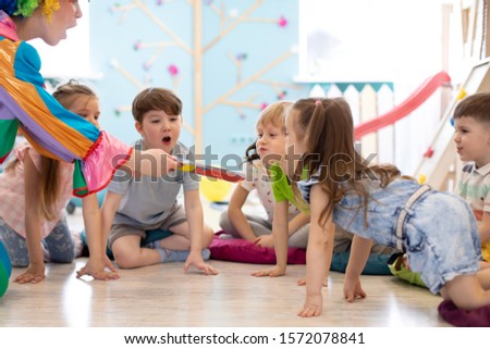 happy children and clown have a fun on birthday party