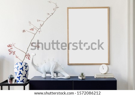 Stylish scandinavian living room with mock up poster frame, navy blue commode, table lamp and elegant accessories. Modern home decor. Interior design. Template Ready to use.