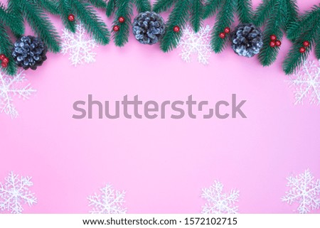 Christmas holidays composition, top view of red Christmas decorations on pink background with copy space for text. Flat lay, winter, postcard template, new year concept.