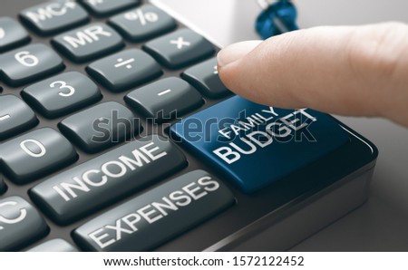 Conceptual Calculator with income, expenses and a finger about to press family budget button. Composite image between a hand photography and a 3D background. Royalty-Free Stock Photo #1572122452