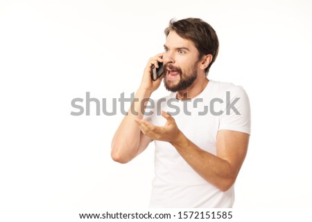 Cheerful man talking on the phone white shirt communication service