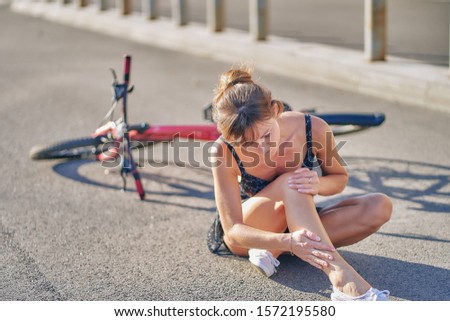 girl fell off the bike.