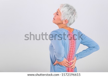 Matur Woman suffering from lower back pain. Mature woman resting with back pain. Female lower back pain. Senior woman injury suffering from backache, Spine in 3d