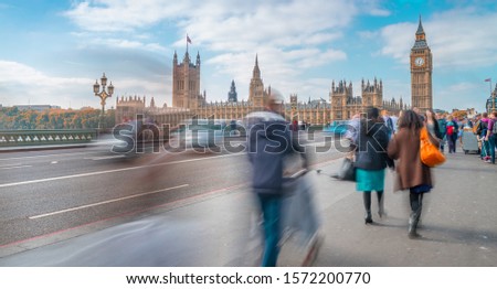 Blurred people moving on Westminster Bridge, London.
