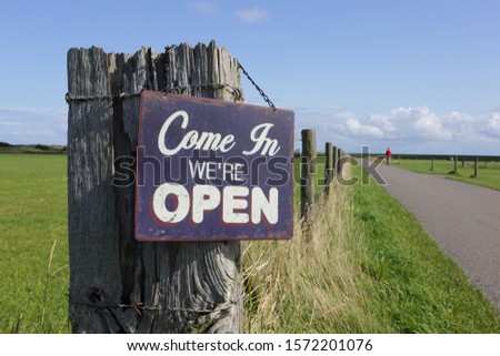 Come in we're open sign