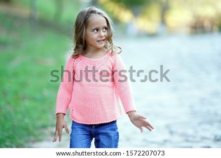 Portrait of a 4 year old girl posing like a model