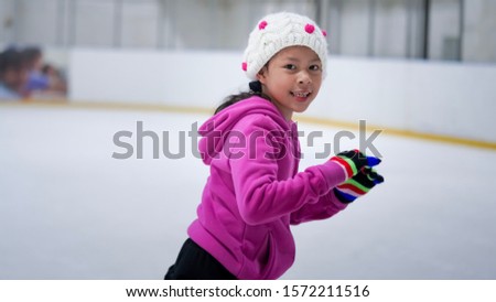 The child is practicing ice skating.