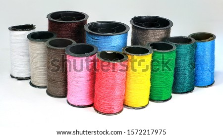 Thread tube colors on a white background. Royalty-Free Stock Photo #1572217975