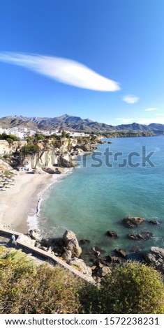 photography from the balcony of Europe, Mediterranean Sea, Nerja, Málaga, Spain, one of the white villages of Andalusia, Spain, holidays, touristic point, famous place, vertical panoramic photo,