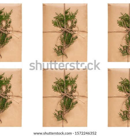Eco gift box wrapping in kraft paper seamless pattern on white background. Eco-friendly natural style. Composition with present decorated with Christmas tree branches. Top view,New year flatlay,mockup