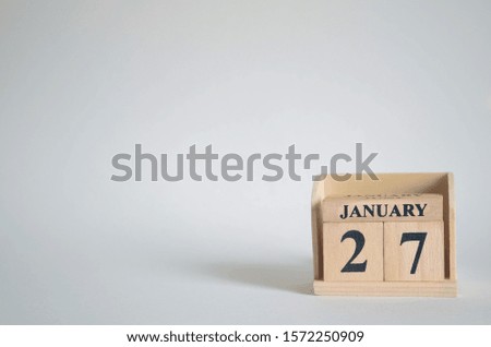 Empty white background with number cube on the table, January 27.