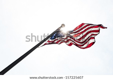 Usa flag in the sky with sun rays