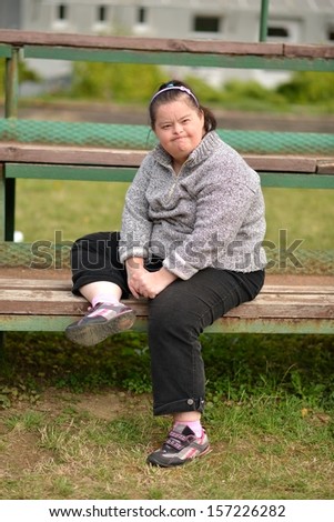 Portrait of beautiful happy woman with Down syndrome