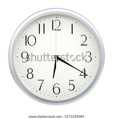 Analog wall clock isolated on white background. Royalty-Free Stock Photo #1572269089