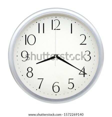 Analog wall clock isolated on white background. Royalty-Free Stock Photo #1572269140