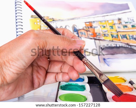 hand of designer working with artist equipment on isolated background
