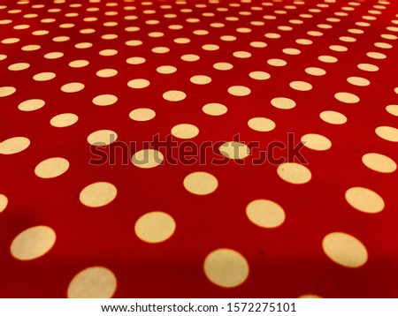 White dots on red background.