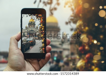 A Man Takes a Picture of St. Isaac's Cathedral in the New Year