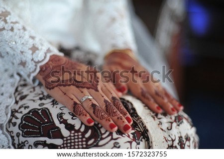Henna In the Hands of a Javanese Traditional Indonesian Wedding Bride