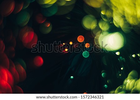 Beautiful optical abstract color bokeh in the darkness  background.