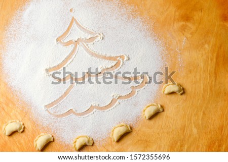 Picture of Christmas tree made from white flour. Merry Christmas and happy new year