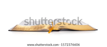 Opened Holy Bible book placed on white background. Church and religion concept.
