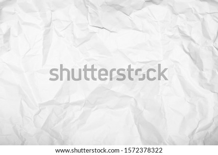 White crumpled paper texture background.