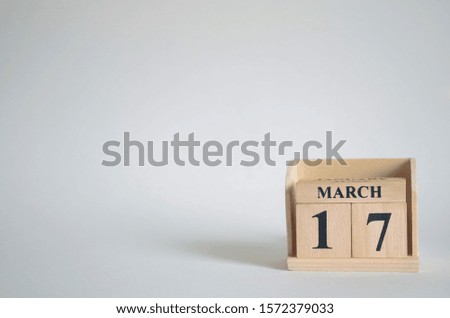 Empty white background with number cube on the table, March 17.