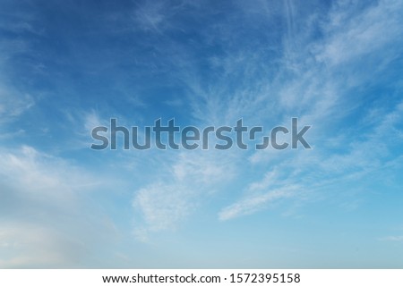 beautiful blue sky with cirrostratus clouds on sunny day background Royalty-Free Stock Photo #1572395158