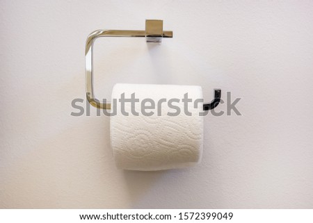 full white toilet roll paper in restroom