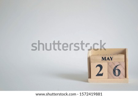 Empty white background with number cube on the table, May 26.