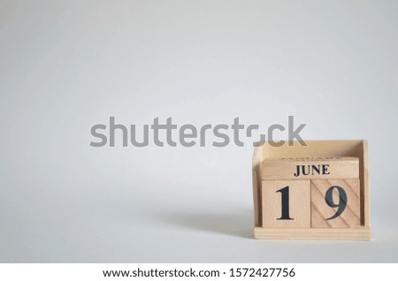 Empty white background with number cube on the table, June 19.