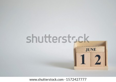 Empty white background with number cube on the table, June 12.